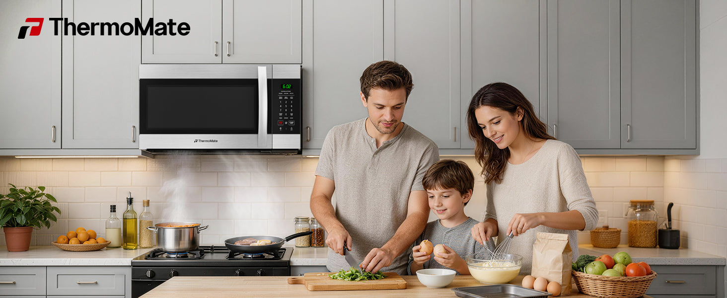 ThermoMate 30-inch stainless steel over-the-range microwave installed above the stove in a modern family kitchen with cooktop lighting and ventilation